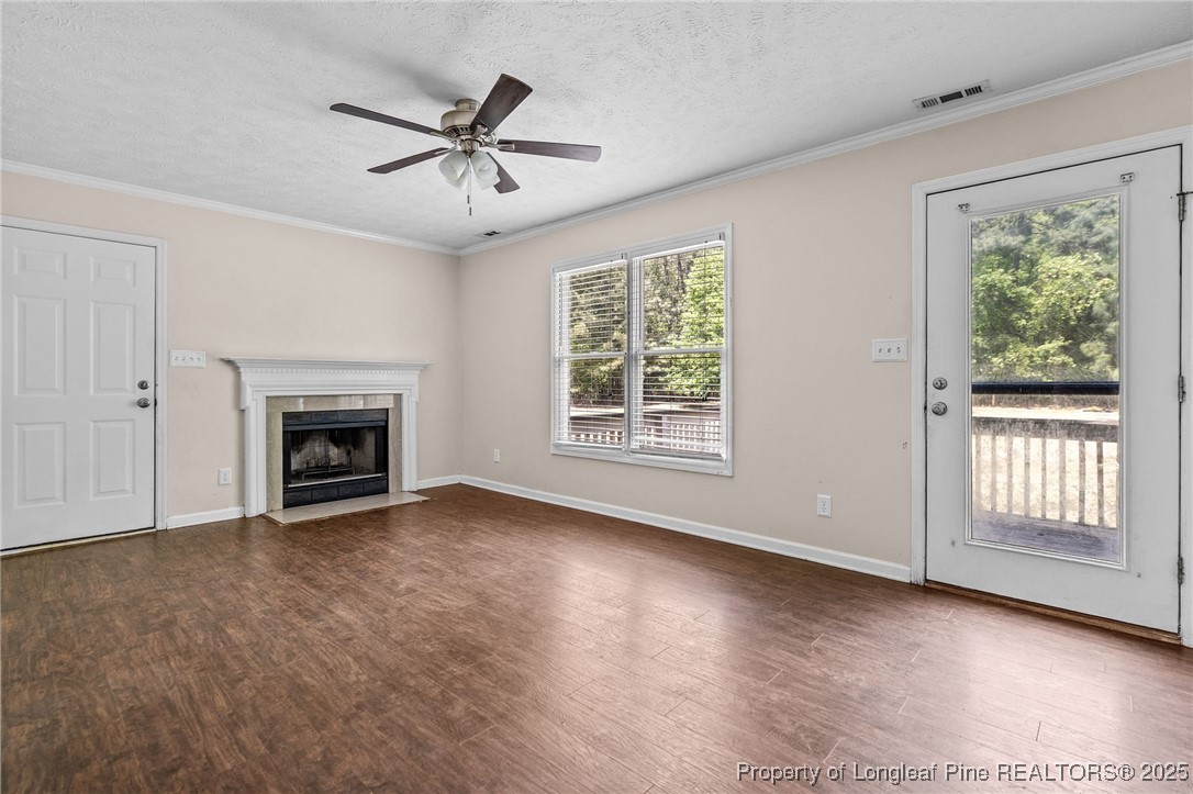 8810 Tangletree Drive Linden, NC 28356 - Photo 19 of 50 a view of livingroom with window fireplace and ceiling fan