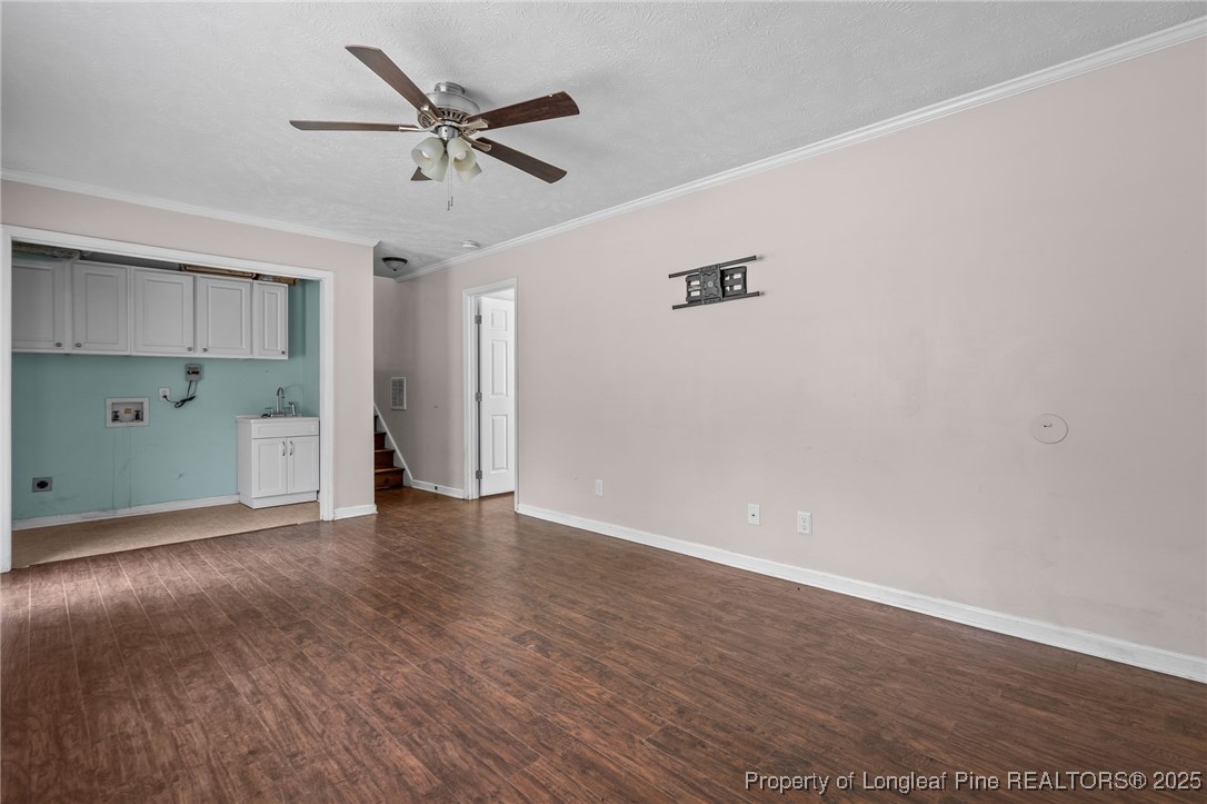 8810 Tangletree Drive Linden, NC 28356 - Photo 20 of 50 a view of a livingroom with a ceiling fan and wooden floor