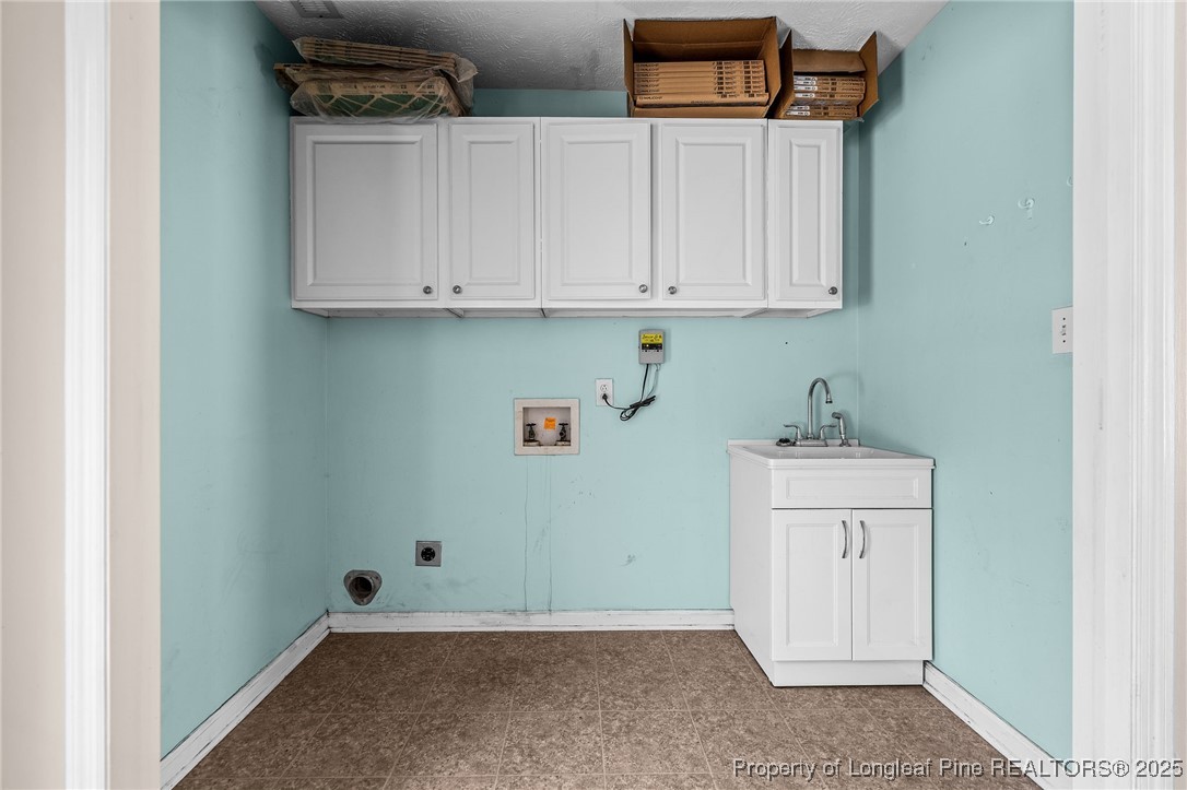 8810 Tangletree Drive Linden, NC 28356 - Photo 21 of 50 a room with storage and utility