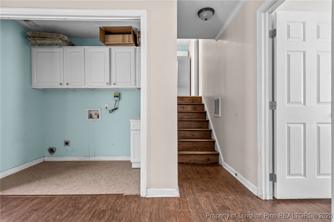 8810 Tangletree Drive Linden, NC 28356 - Photo 23 of 50 a view of an entryway with wooden floor and cabinet