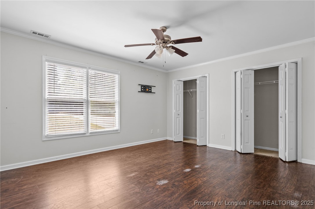 8810 Tangletree Drive Linden, NC 28356 - Photo 24 of 50 a view of empty room with wooden floor and fan