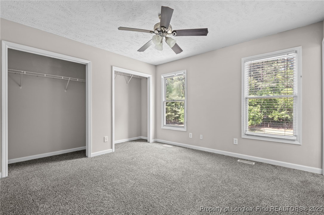 8810 Tangletree Drive Linden, NC 28356 - Photo 33 of 50 a view of a room with a ceiling fan and a window