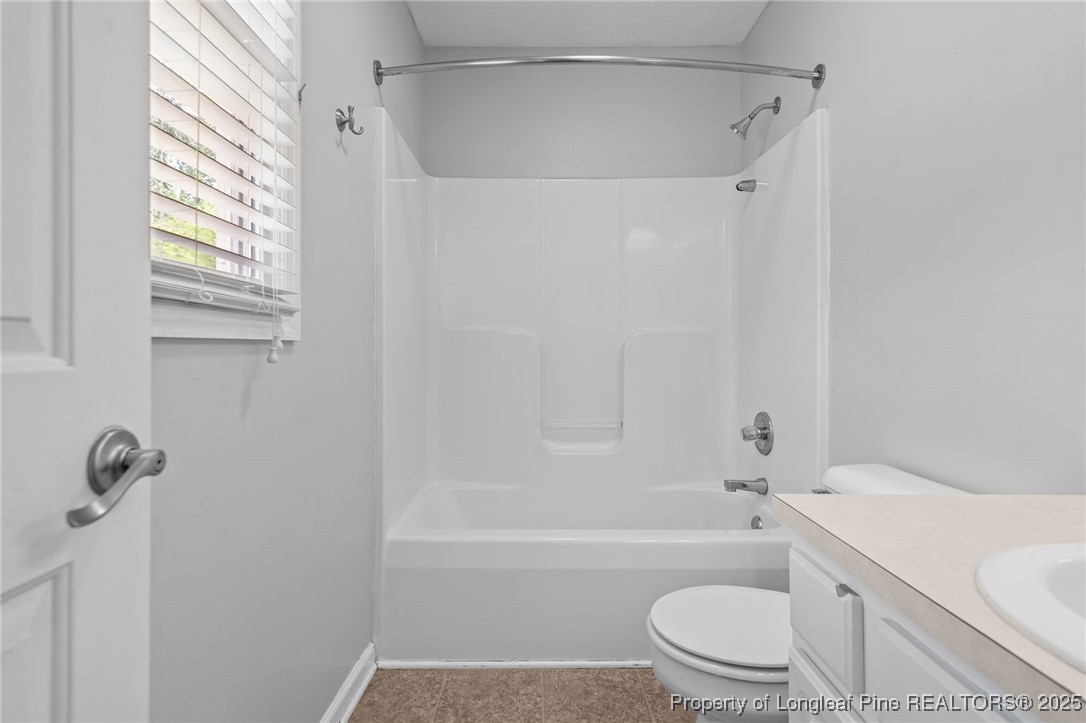 8810 Tangletree Drive Linden, NC 28356 - Photo 35 of 50 a bathroom with a toilet and a bathtub