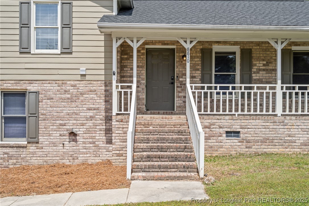 8810 Tangletree Drive Linden, NC 28356 - Photo 5 of 50 a view of a brick house with plants
