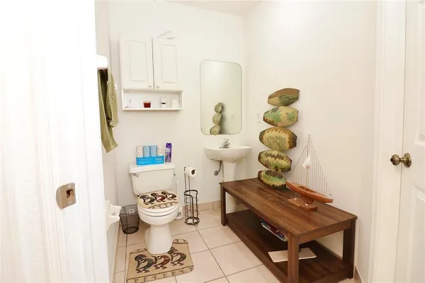 a living room with a table and chairs