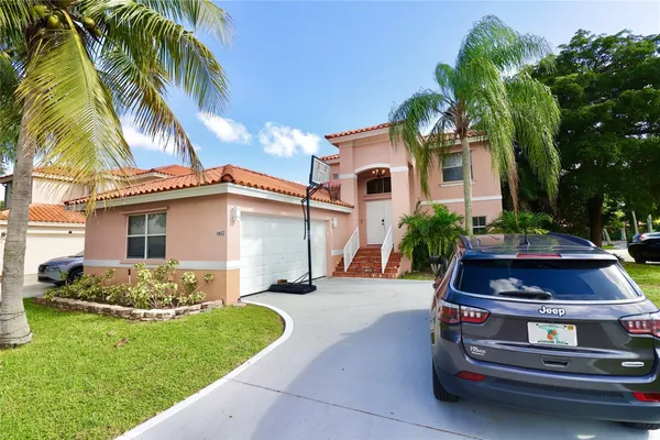 a house with palm tree in front of it