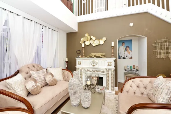 a bedroom with furniture and a fireplace