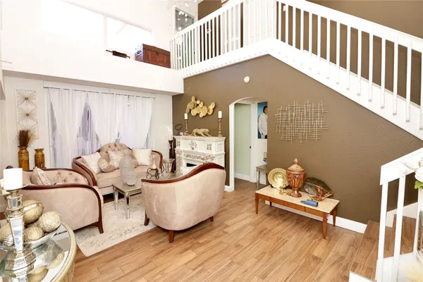 a living room with furniture and a table