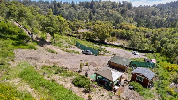 an aerial view of house with yard
