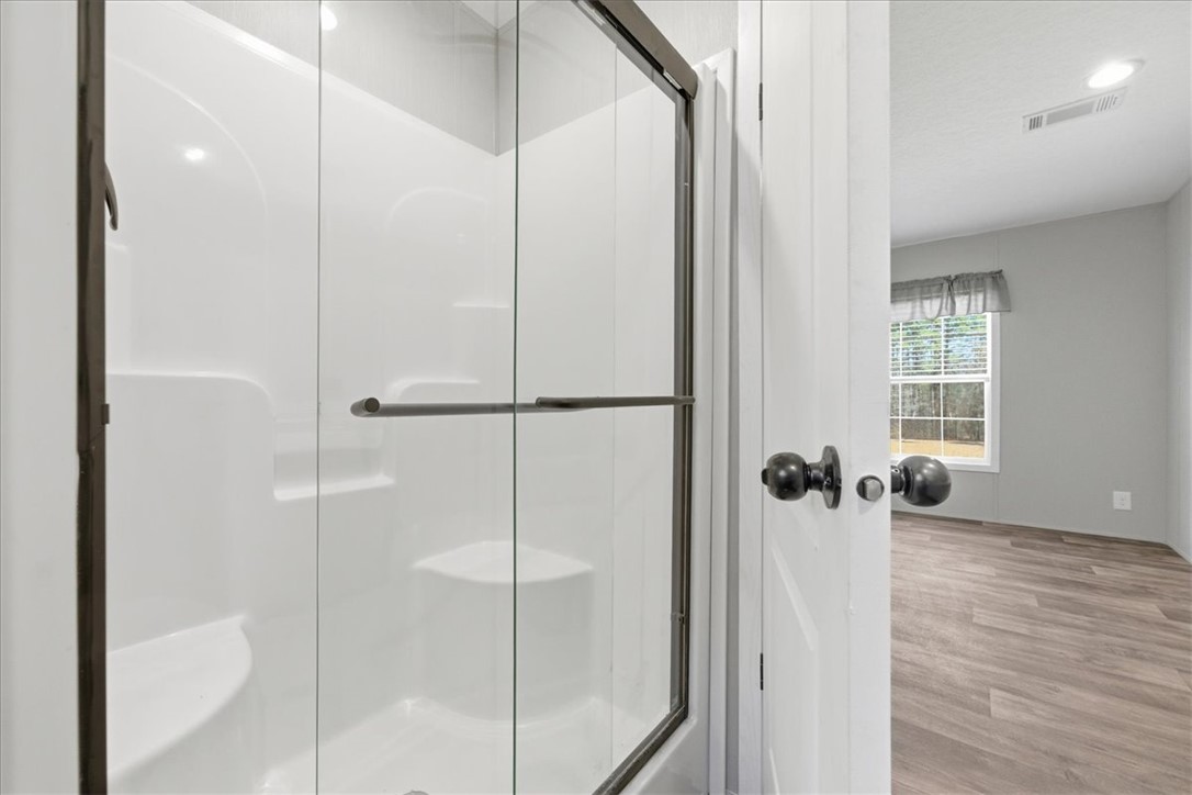 205 Union Court West Union, SC 29696 - Photo 18 of 28 This clean and inviting shower features a clear glass door.