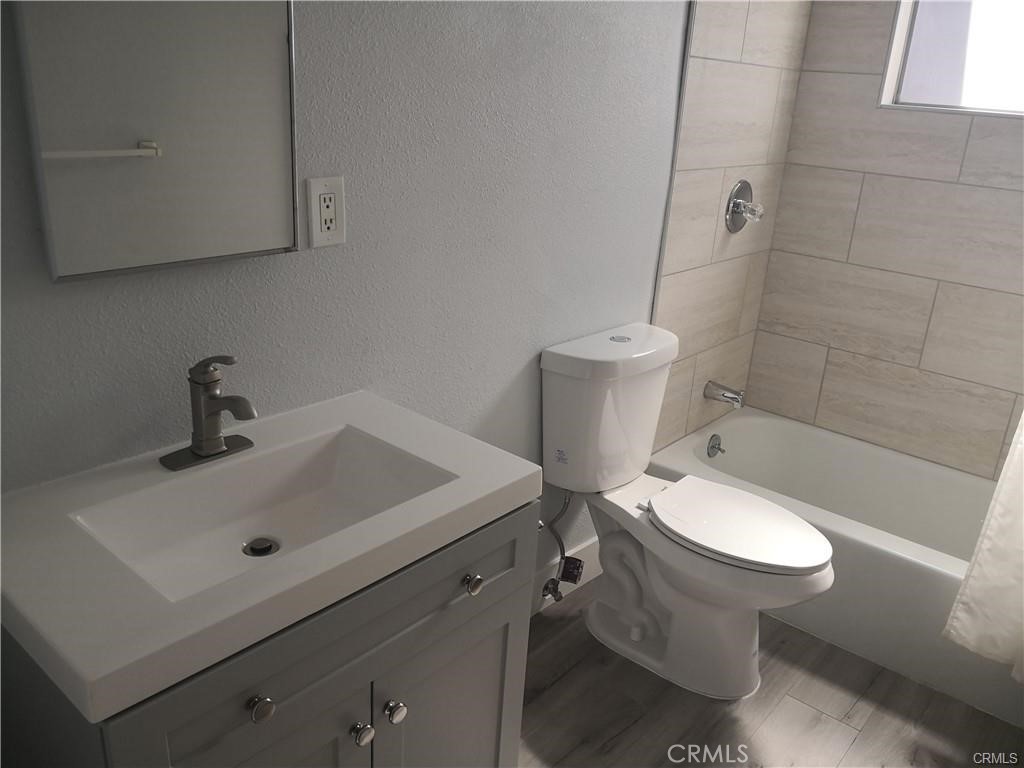 4217 Maple Trail Frazier Park, CA 93225 - Photo 12 of 12 a white toilet sitting next to a bathroom sink