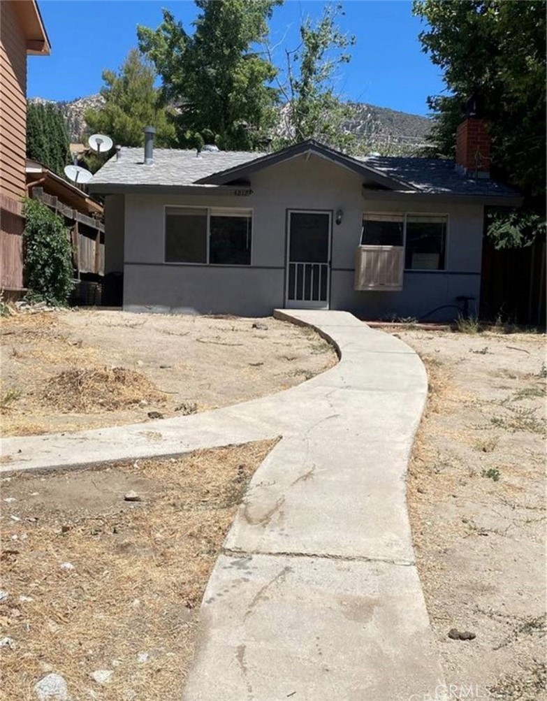 4217 Maple Trail Frazier Park, CA 93225 - Photo 2 of 12 a view of a white house with a wooden fence