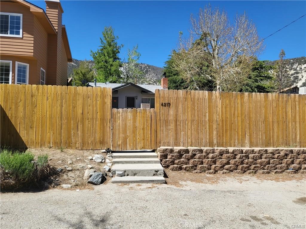 4217 Maple Trail Frazier Park, CA 93225 - Photo 3 of 12 a front view of a house with a garden