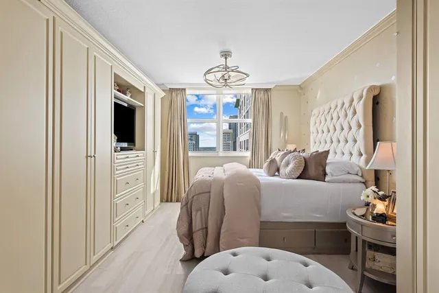 a bedroom with furniture and a window