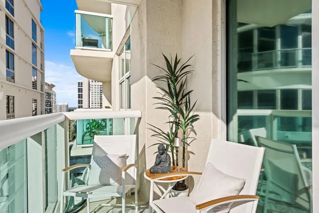 a view of a patio with table and chairs and potted plants