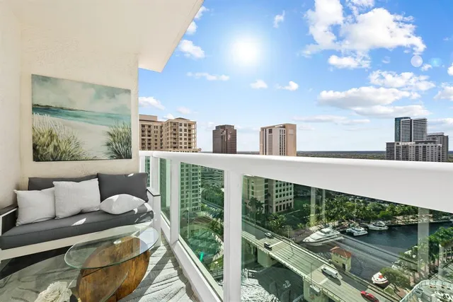 a balcony with furniture and city view