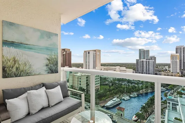 a view of a balcony with furniture
