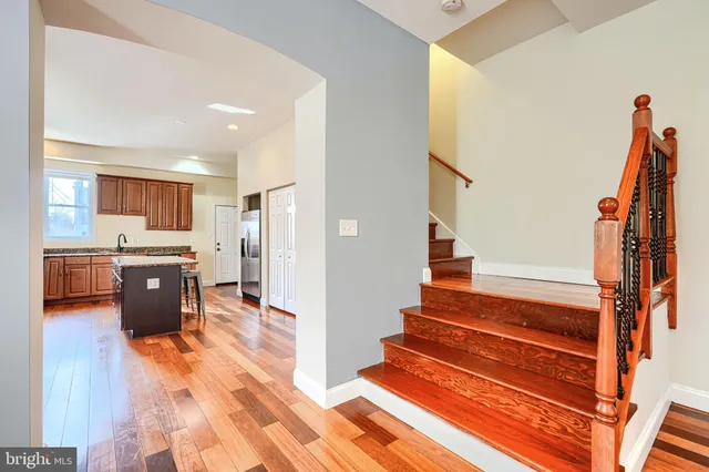 a view of kitchen with stainless steel appliances cabinets and a sink
