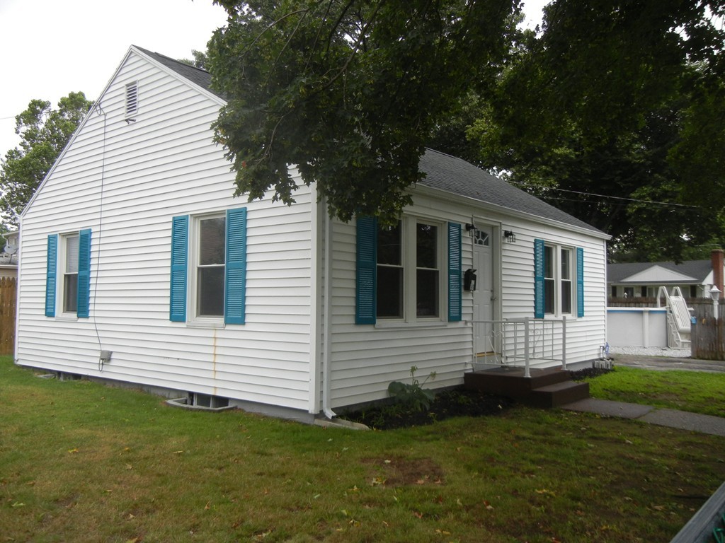 141 Freeman Terrace Springfield, MA 01104 - Photo 1 of 21 a front view of a house with a garden