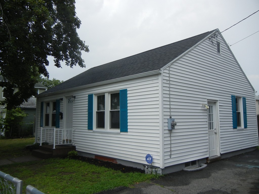 141 Freeman Terrace Springfield, MA 01104 - Photo 2 of 21 a front view of a house with a yard