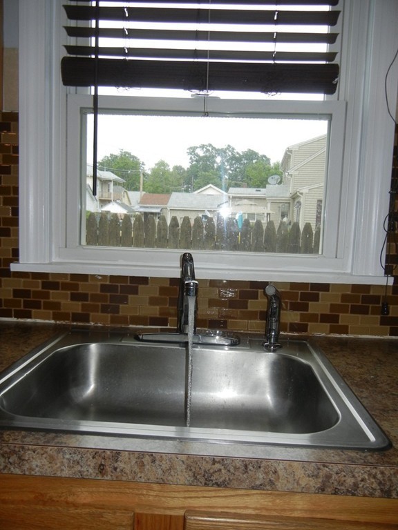 141 Freeman Terrace Springfield, MA 01104 - Photo 8 of 21 a kitchen sink with a stove