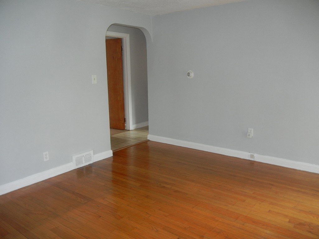 141 Freeman Terrace Springfield, MA 01104 - Photo 10 of 21 a view of an empty room with wooden floor and closet