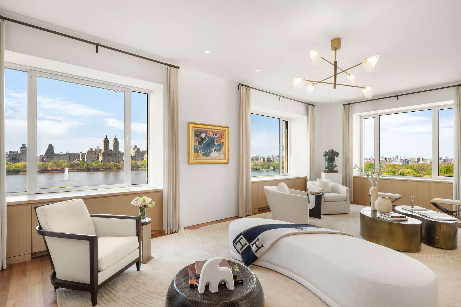 2 East 88th Street, Unit 11 Manhattan, NY 10128 - Photo 1 of 26 a living room with furniture and a large window