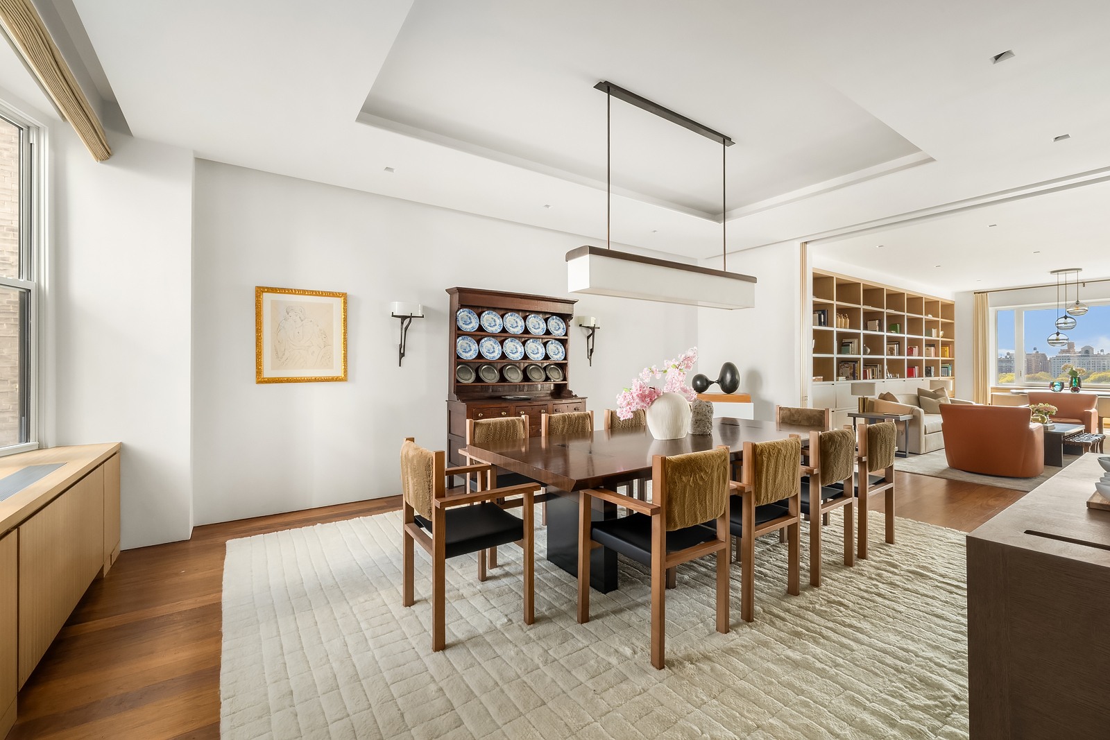 2 East 88th Street, Unit 11 Manhattan, NY 10128 - Photo 10 of 26 a view of a dining room with furniture and wooden floor