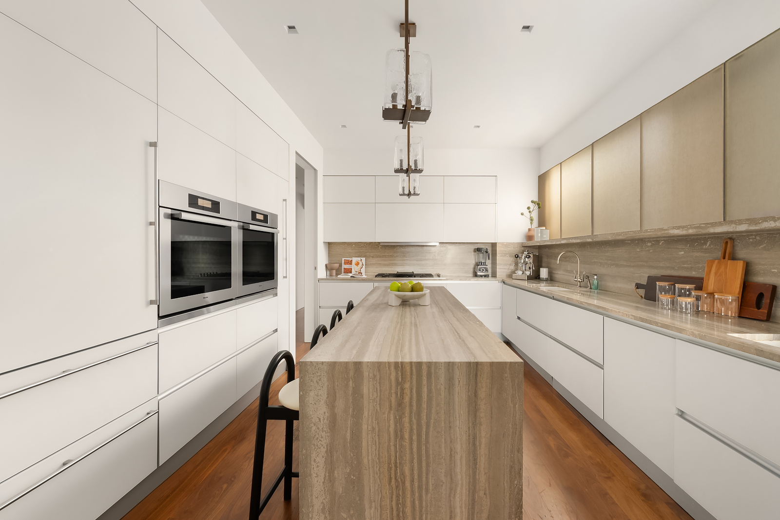 2 East 88th Street, Unit 11 Manhattan, NY 10128 - Photo 11 of 26 a kitchen with stainless steel appliances a stove a sink a microwave and cabinets