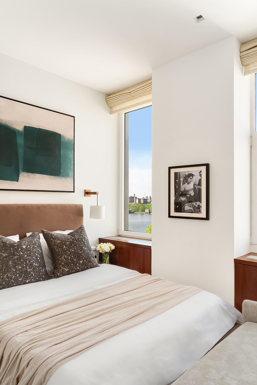 2 East 88th Street, Unit 11 Manhattan, NY 10128 - Photo 18 of 26 a bedroom with a bed and window