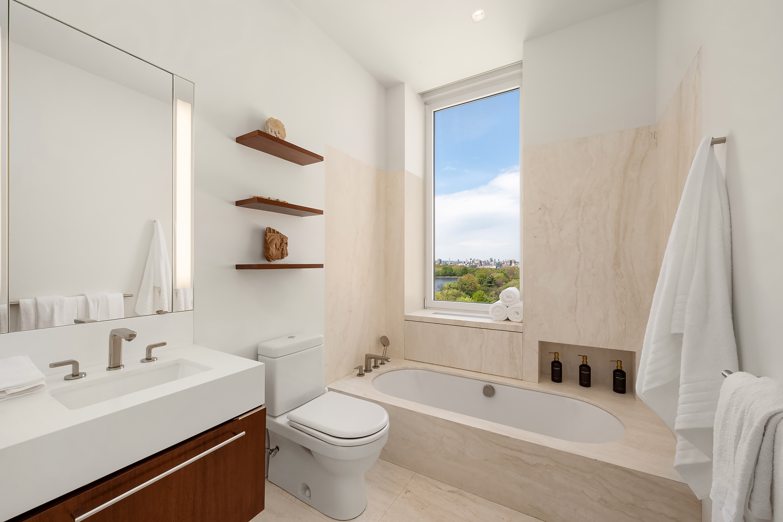 2 East 88th Street, Unit 11 Manhattan, NY 10128 - Photo 19 of 26 a bathroom with a sink a toilet and a bathtub