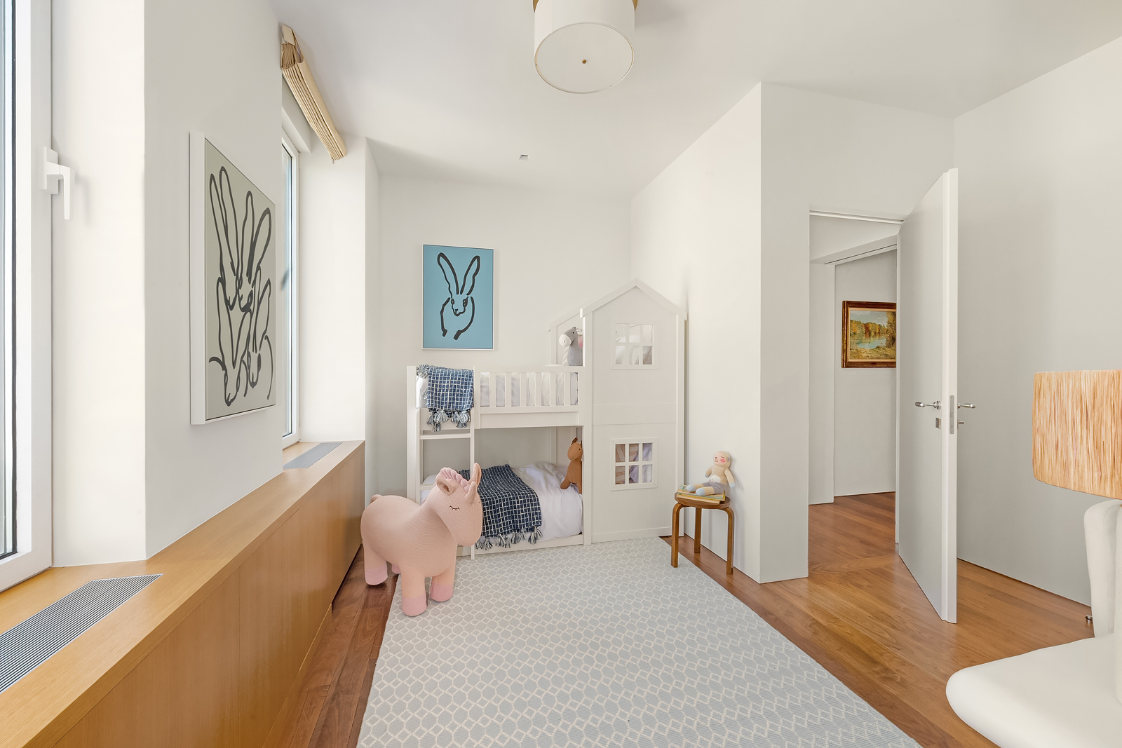 2 East 88th Street, Unit 11 Manhattan, NY 10128 - Photo 21 of 26 a bedroom with furniture and a wooden floor
