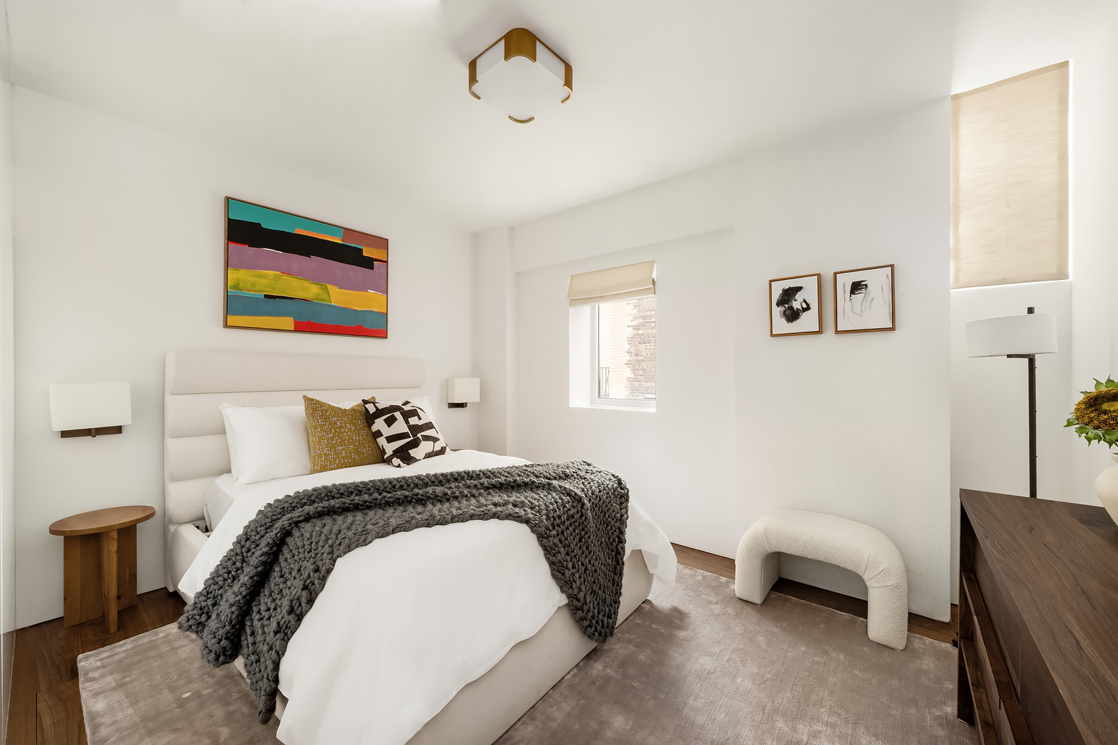 2 East 88th Street, Unit 11 Manhattan, NY 10128 - Photo 23 of 26 a bedroom with a bed and a couch