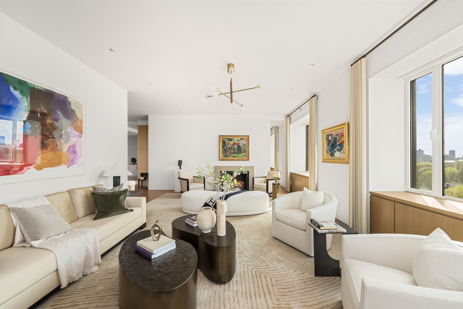 2 East 88th Street, Unit 11 Manhattan, NY 10128 - Photo 2 of 26 a living room with furniture and a large window