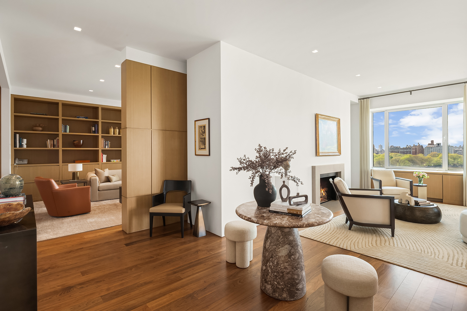 2 East 88th Street, Unit 11 Manhattan, NY 10128 - Photo 3 of 26 a living room with furniture and a large window
