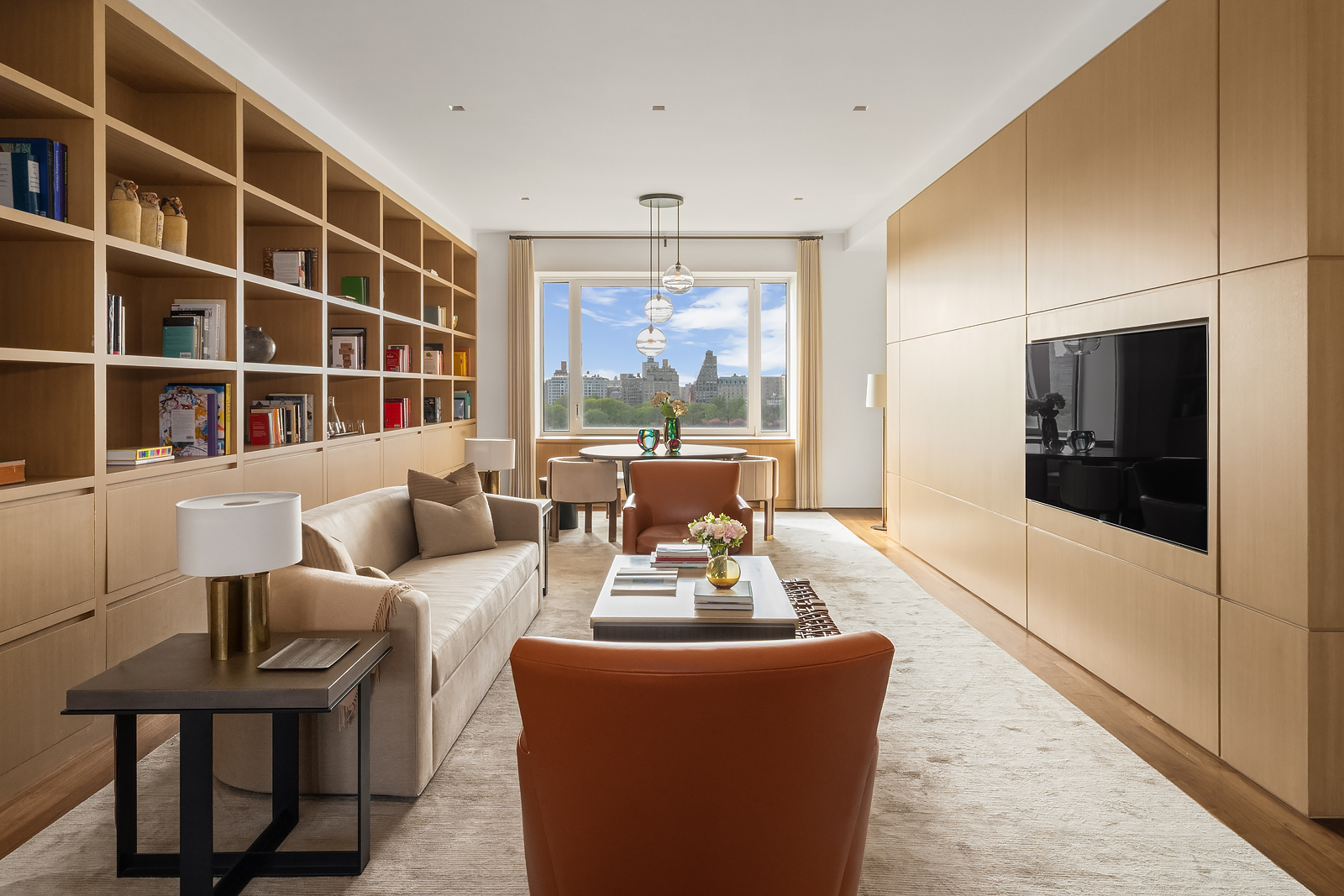 2 East 88th Street, Unit 11 Manhattan, NY 10128 - Photo 5 of 26 a living room with furniture and a large window