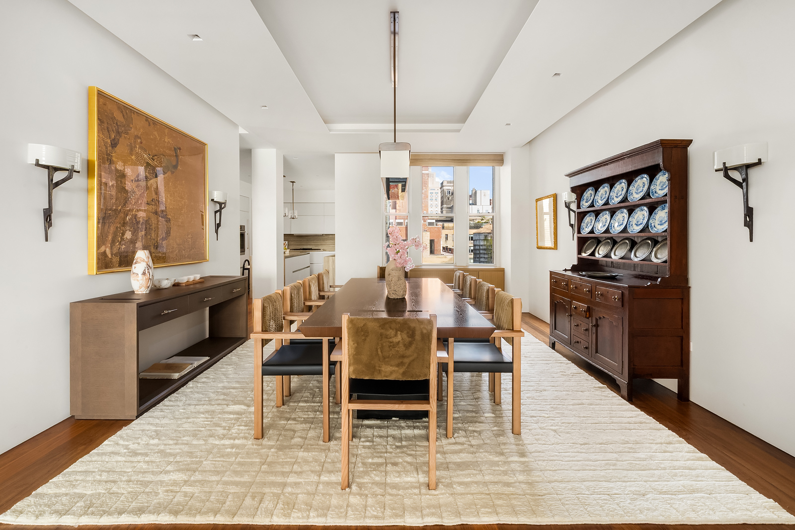2 East 88th Street, Unit 11 Manhattan, NY 10128 - Photo 9 of 26 a dining room with furniture and wooden floor