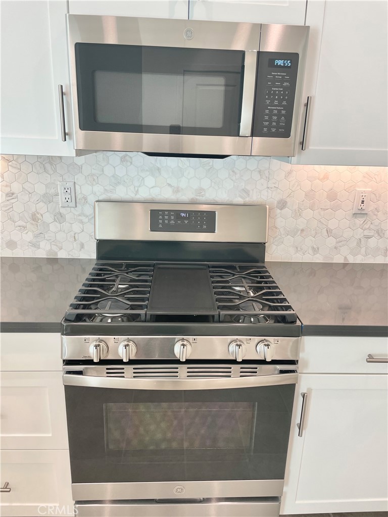 39396 Corvina Lane Temecula, CA 92591 - Photo 13 of 63 a stove top oven sitting inside of a kitchen