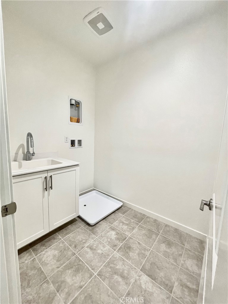 39396 Corvina Lane Temecula, CA 92591 - Photo 27 of 63 a bathroom with a sink toilet and mirror
