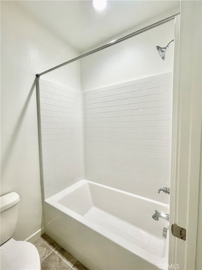 39396 Corvina Lane Temecula, CA 92591 - Photo 34 of 63 a bathroom with a bathtub and a toilet