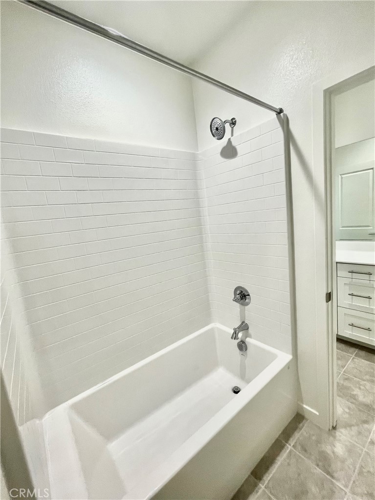39396 Corvina Lane Temecula, CA 92591 - Photo 35 of 63 a bathroom with a tub and shower