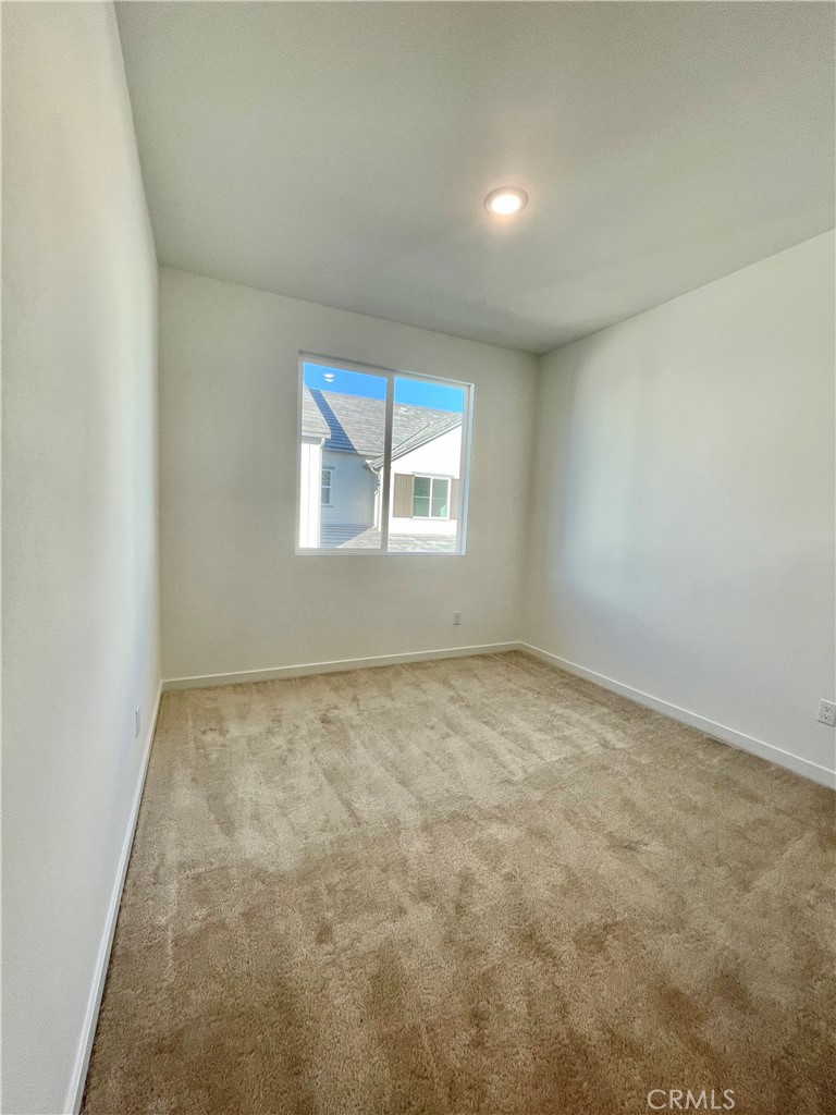 39396 Corvina Lane Temecula, CA 92591 - Photo 37 of 63 an empty room with a windows