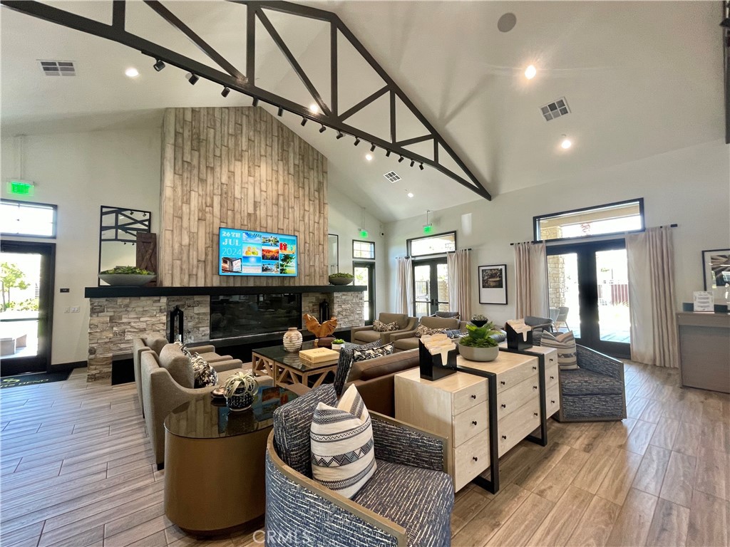 39396 Corvina Lane Temecula, CA 92591 - Photo 49 of 63 a living room with lots of furniture and a wooden floor