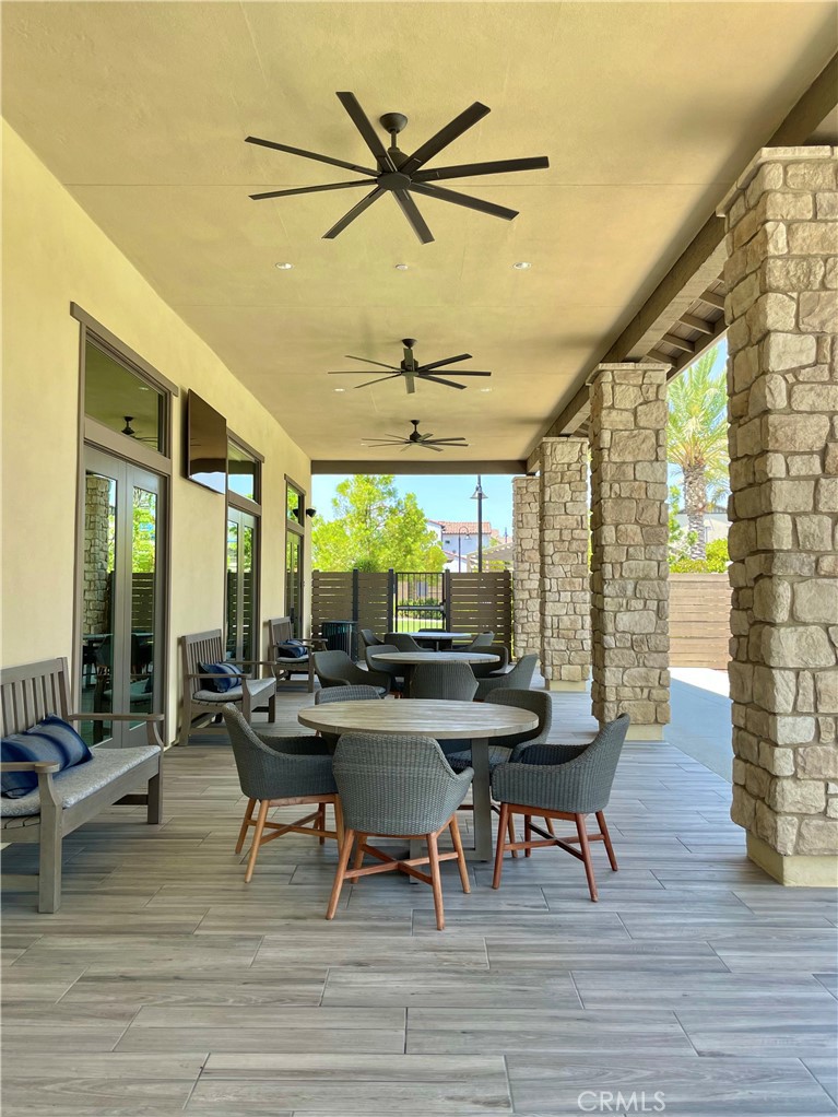 39396 Corvina Lane Temecula, CA 92591 - Photo 51 of 63 a view of a dining room with furniture window and wooden floor