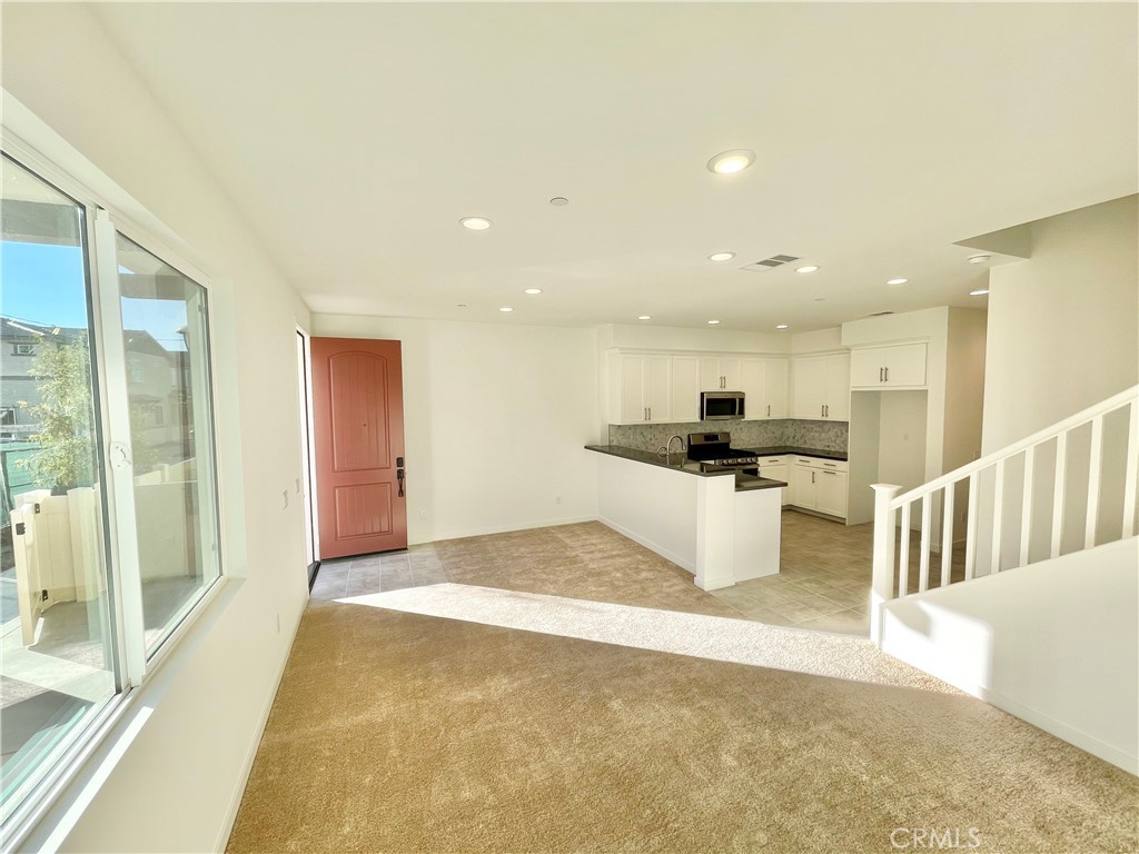39396 Corvina Lane Temecula, CA 92591 - Photo 6 of 63 a view of kitchen with kitchen island sink and refrigerator
