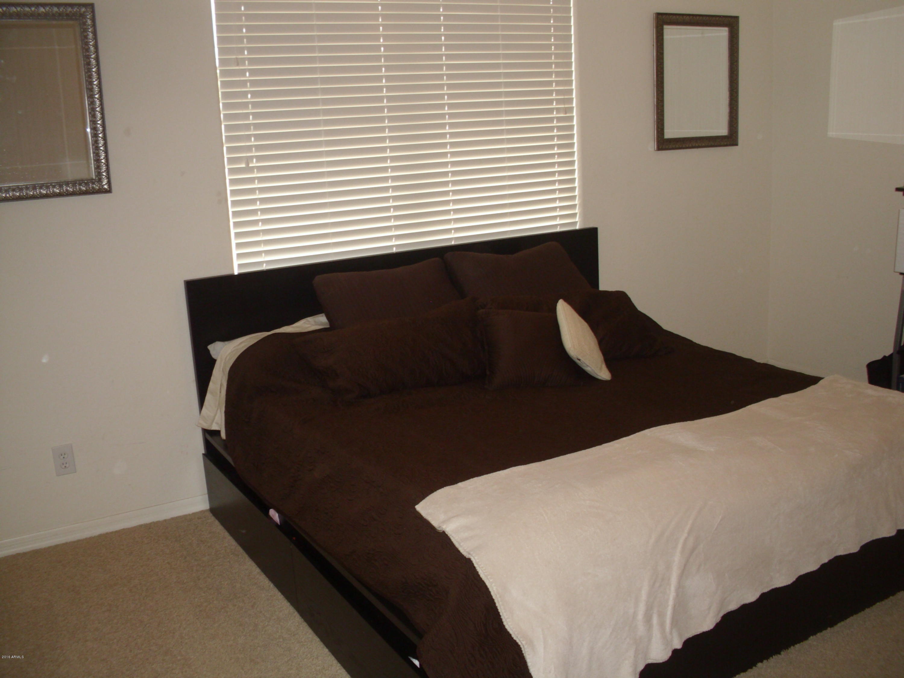 10124 West Chipman Road Tolleson, AZ 85353 - Photo 19 of 22 Master Bedroom