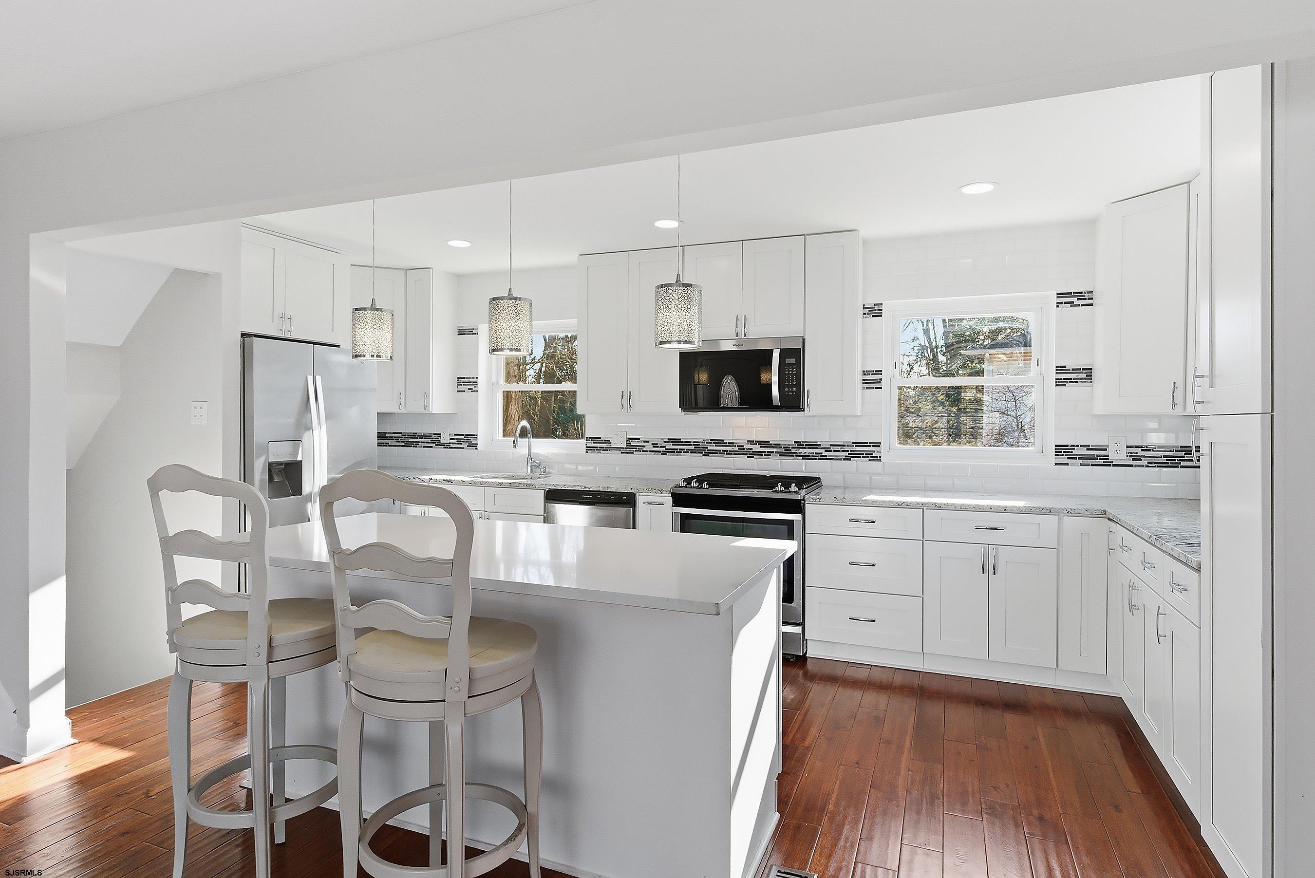 183 Jordan Road Somers Point, NJ 08244 - Photo 13 of 42 a kitchen with white cabinets and stainless steel appliances