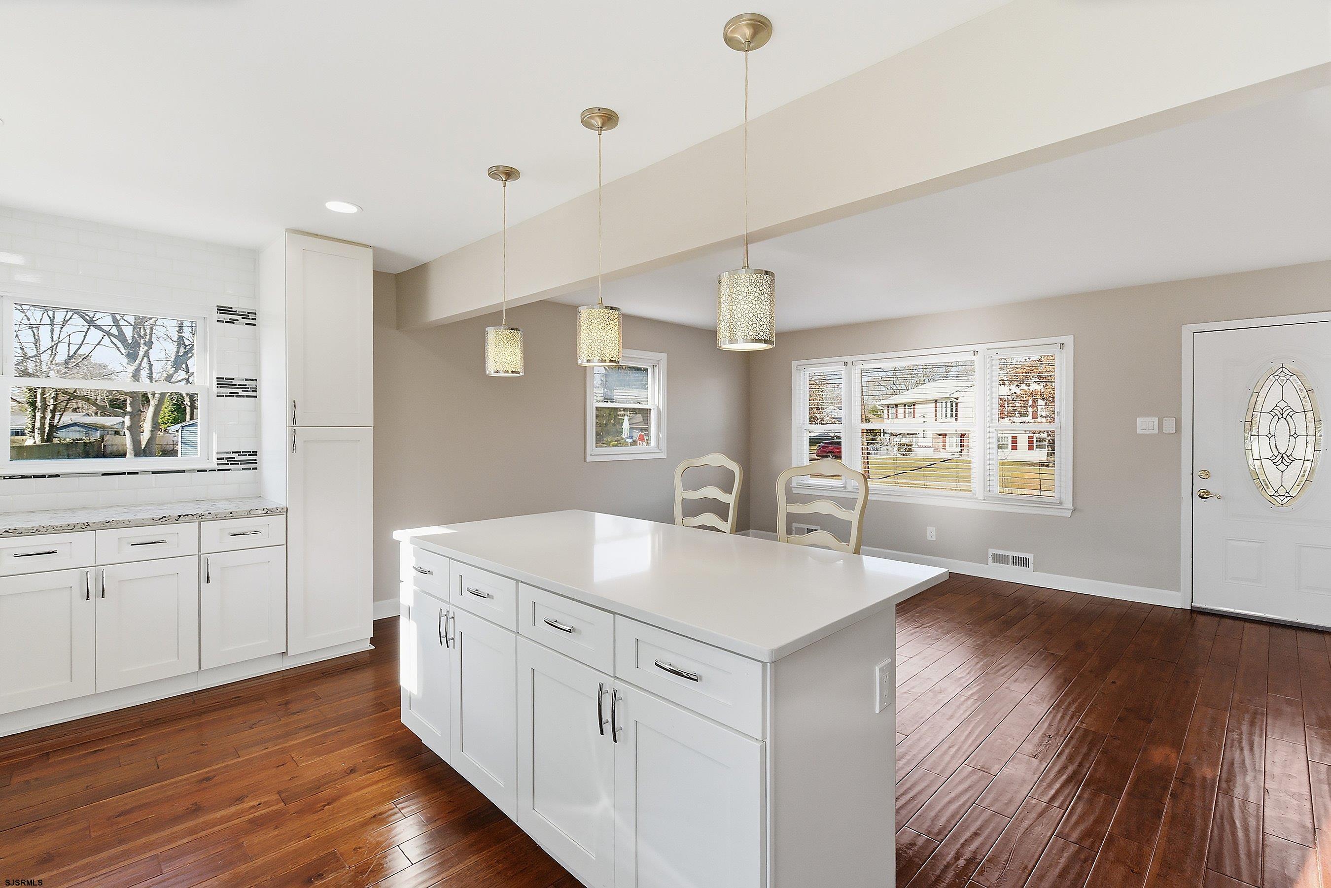183 Jordan Road Somers Point, NJ 08244 - Photo 18 of 42 a kitchen with a stove a sink and wooden floor