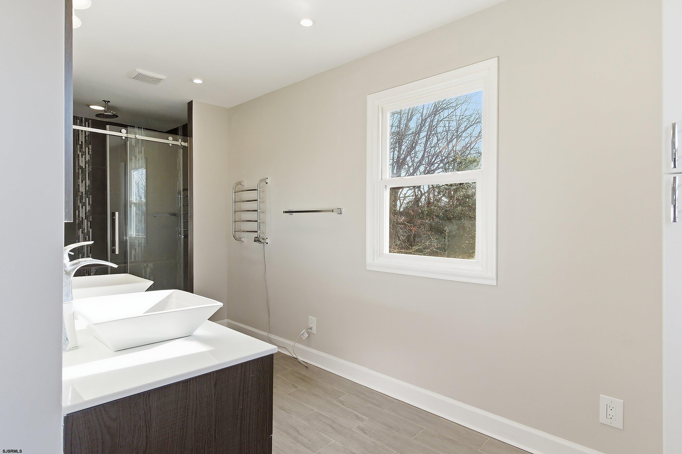 183 Jordan Road Somers Point, NJ 08244 - Photo 29 of 42 a bathroom with a sink vanity granite and a mirror