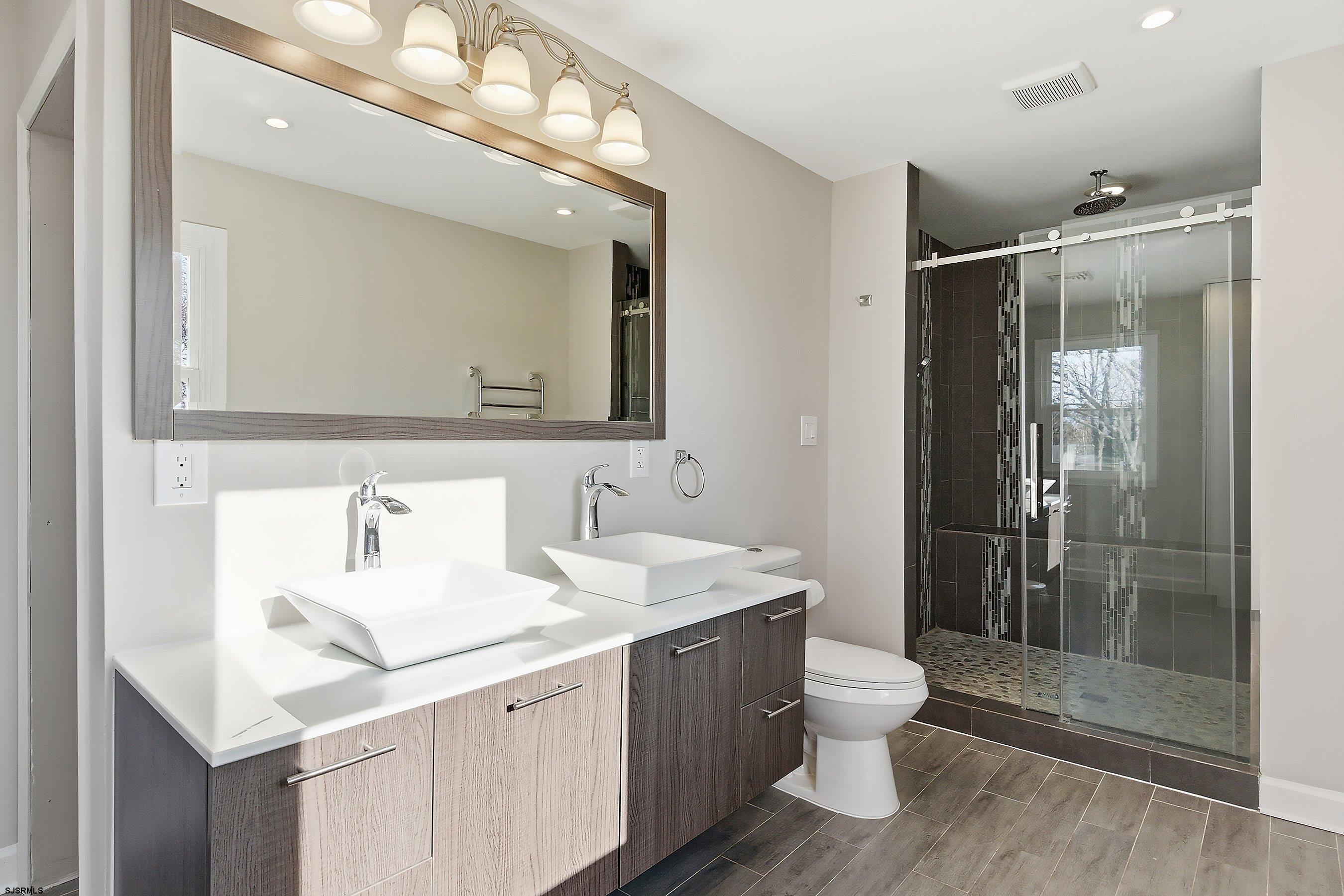 183 Jordan Road Somers Point, NJ 08244 - Photo 30 of 42 a bathroom with a double vanity sink mirror and toilet
